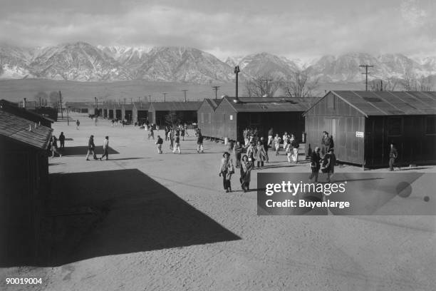 Students walking in road between buildings. Ansel Easton Adams was an American photographer, best known for his black-and-white photographs of the...