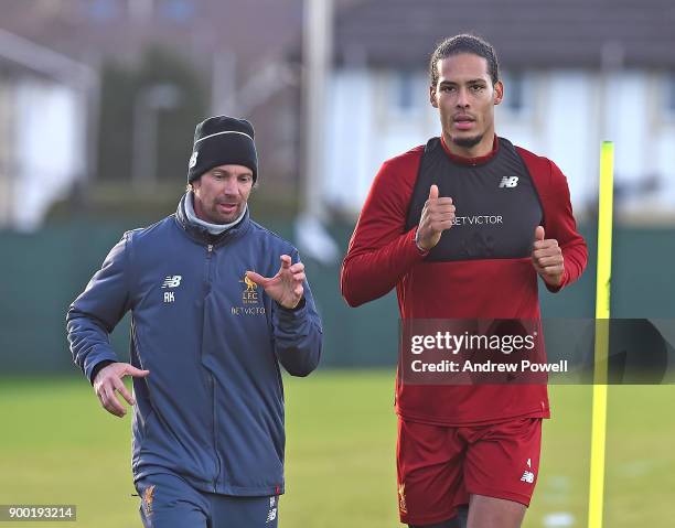 Virgil van Dijk new signing of Liverpool with Andreas Kornmayer head of fitness and conditioning at Melwood Training Ground on December 31, 2017 in...