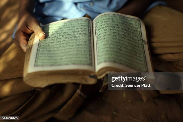 Children recite the Koran at a village school in Dadaab, the world�s biggest refugee complex August 22, 2009 in Dadaab, Kenya. The Dadaab refugee...