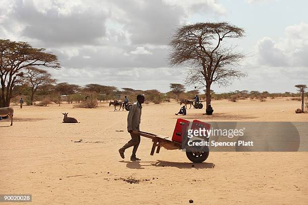 Man carts sodas through the sand in Dadaab, the world�s biggest refugee complex August 22, 2009 in Dadaab, Kenya. The Dadaab refugee complex in...