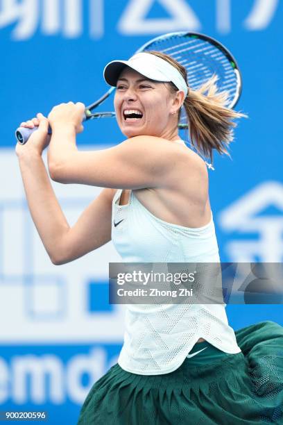 Maria Sharapova of Russia returns a shot during the match against Mihaela Buzarnescu of Romania during Day 2 of 2018 WTA Shenzhen Open at Longgang...