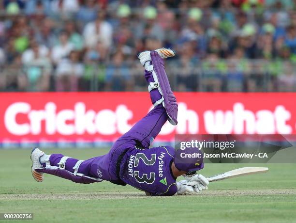 Arcy Short of the Hurricanes falls during the Big Bash League match between the Sydney Thunder and the Hobart Hurricanes at Spotless Stadium on...