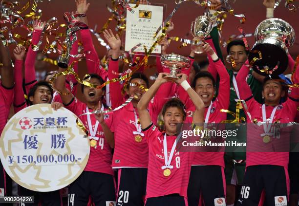 Players of Cerezo Osaka celebrate as captain Yoichiro Kakitani lifts the trophy after the 97th All Japan Football Championship final between Cerezo...