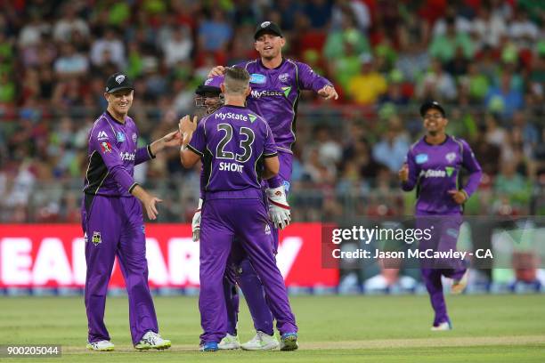 Arcy Short of the Hurricanes celebrates with team mates after dismissing Kurtis Patterson of the Thunder during the Big Bash League match between the...