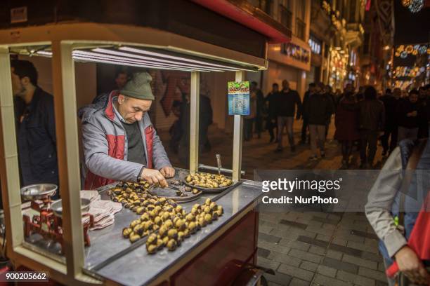 Man selling , a famous meal in Turkey in Istiklal Street last night in 2017