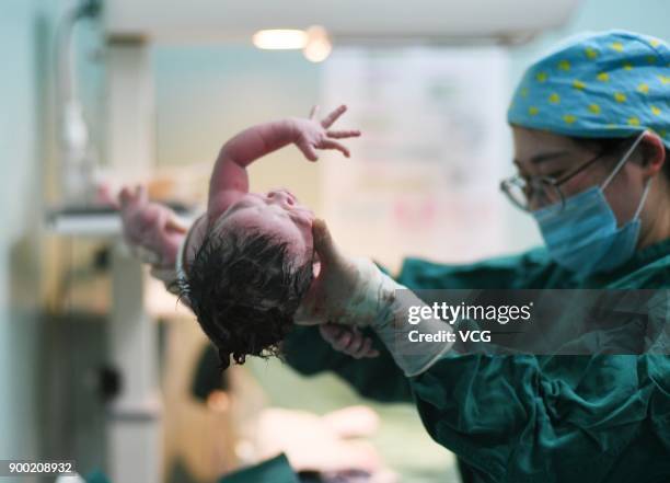 Newborn girl becomes the first baby born in the New Year at Nanjing Maternity and Child Health Hospital on January 1, 2018 in Nanjing, Jiangsu...