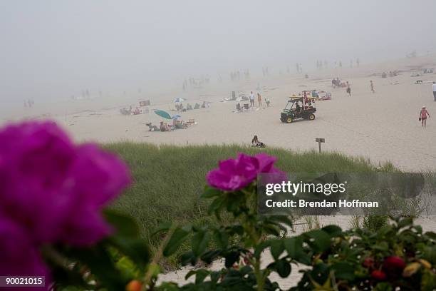 Lighthouse Beach is packed with curious onlookers because of high surf on August 22, 2009 in Chatham, Massachusetts. A strong undertow and high surf...