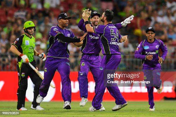 Matthew Wade of the Hurricanes celebrates running out Jos Buttler of the Thunder during the Big Bash League match between the Sydney Thunder and the...
