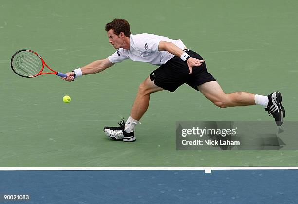 Andy Murray of Great Britain hits a forehand against Roger Federer of Switzerland during day six of the Western & Southern Financial Group Masters on...