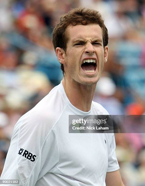 Andy Murray of Great Britain reacts to a missed shot during his semi final loss to Roger Federer of Switzerland during day six of the Western &...