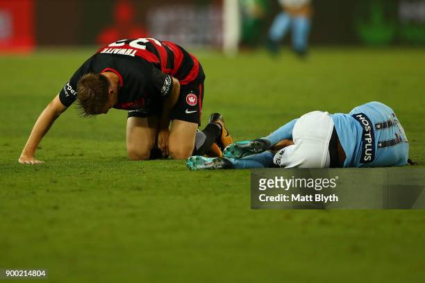 Bruce Kamau of City and Michael Thwaite of the Wanderers collide during the round 13 A-League match between the Western Sydney Wanderers and...
