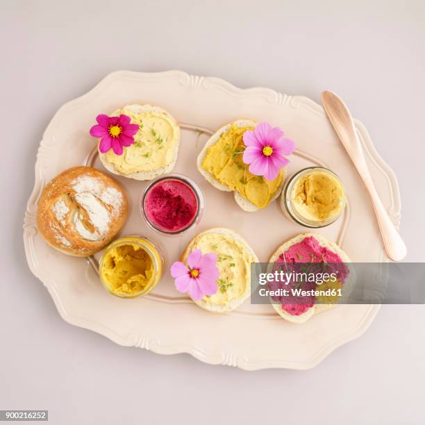 bread rolls with vegan spreads and edible flowers - serving dish stock pictures, royalty-free photos & images