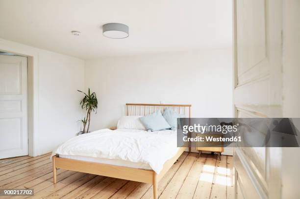 bright modern bedroom in an old country house - empty bedroom stock-fotos und bilder