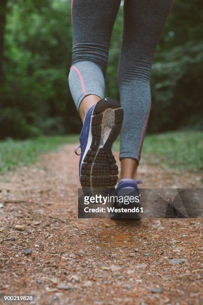 close-up of a woman running - sports shoe close up stock pictures, royalty-free photos & images