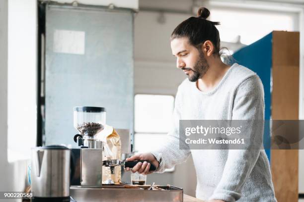 man preparing espresso with espresso machine - coffee machine home stock pictures, royalty-free photos & images