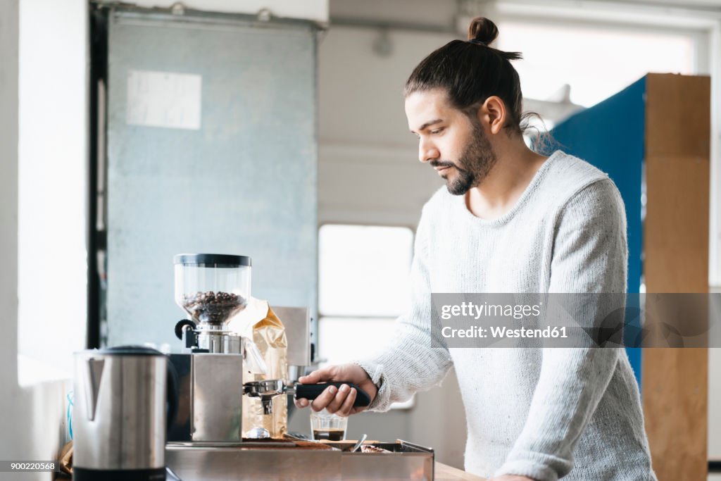 Man preparing espresso with espresso machine