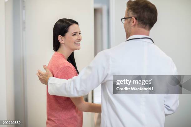 doctor shaking hands with patient in medical practice - doctor leaving stock pictures, royalty-free photos & images