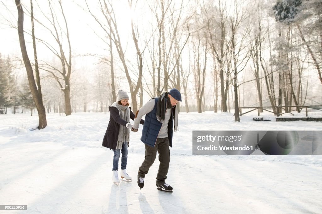 Senior couple ice skating