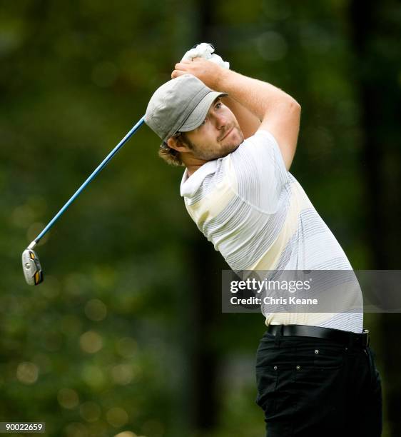Ryan Moore watches his drive on the sixth hole during the third round of the Wyndham Championship at Sedgefield Country Club on August 22, 2009 in...