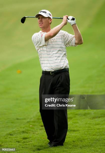 Chris Riley watches his approach on the sixth hole during the third round of the Wyndham Championship at Sedgefield Country Club on August 22, 2009...