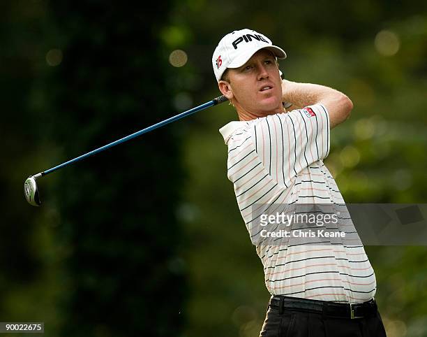Chris Riley watches his drive on the sixth hole during the third round of the Wyndham Championship at Sedgefield Country Club on August 22, 2009 in...