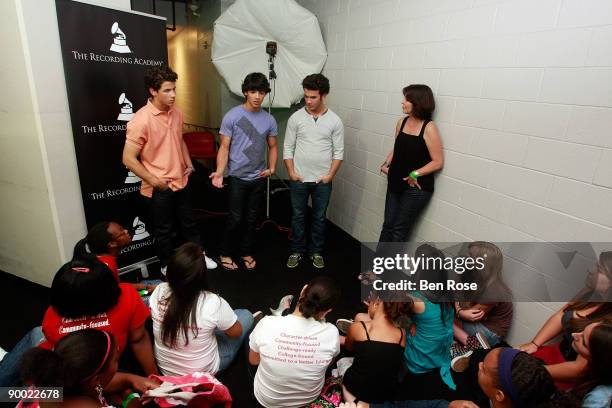 Kevin Jonas, Joe Jonas, Nick Jonas and NARAS Atlanta Chapter President Michele Caplinger attend SoundCheck with the Jonas Brothers & Jordin Sparks...