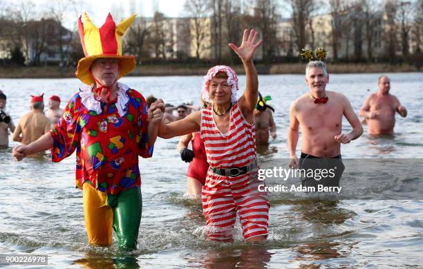 Winter swimmers bathe in Orankesee lake on January 1, 2018 in Berlin, Germany. Unseasonably higher-than-average winter temperatures meant no ice for...