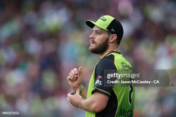 Mitch McClenaghan of the Thunder looks on during the Big Bash League match between the Sydney Thunder and the Hobart Hurricanes at Spotless Stadium...