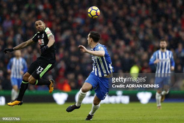 Bournemouth's English striker Callum Wilson vies with Brighton's English defender Lewis Dunk during the English Premier League football match between...