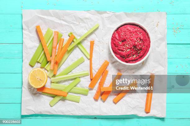 bowl of beetroot hummus, sesame, and carrot and celery crudites - beetroot stock pictures, royalty-free photos & images