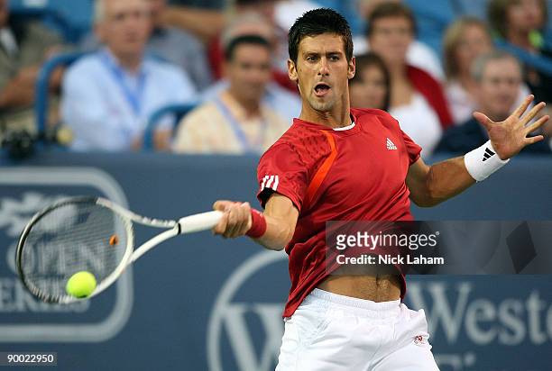 Novak Djokovic of Serbia hits a forehand against Rafael Nadal of Spain in their semi final during day six of the Western & Southern Financial Group...