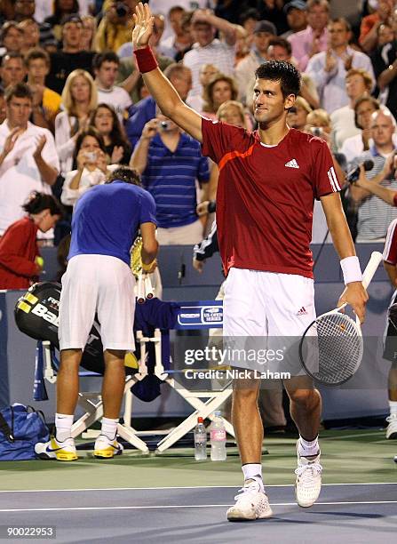 Novak Djokovic of Serbia waves to the crowd after defeating Rafael Nadal of Spain in their semi final during day six of the Western & Southern...