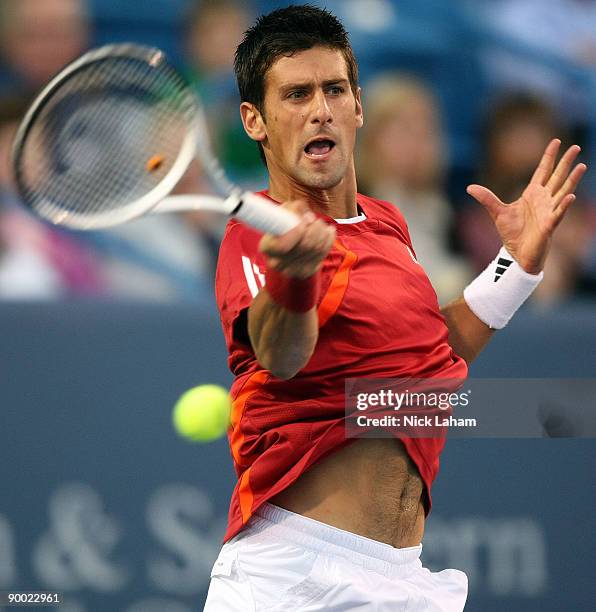 Novak Djokovic of Serbia hits a forehand against Rafael Nadal of Spain in their semi final during day six of the Western & Southern Financial Group...