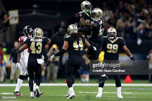 Marshon Lattimore of the New Orleans Saints and Ken Crawley of the New Orleans Saints react after a play during a NFL game against the Atlanta...