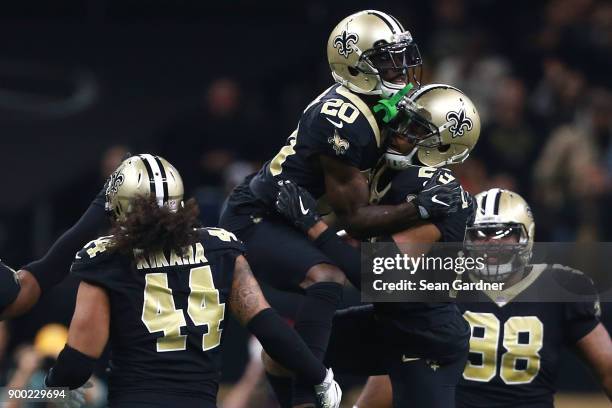 Marshon Lattimore of the New Orleans Saints and Ken Crawley of the New Orleans Saints react after a play during a NFL game against the Atlanta...