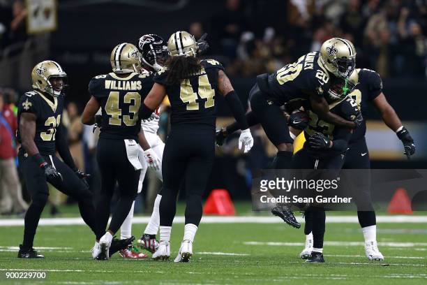 Marshon Lattimore of the New Orleans Saints and Ken Crawley of the New Orleans Saints react after a play during a NFL game against the Atlanta...