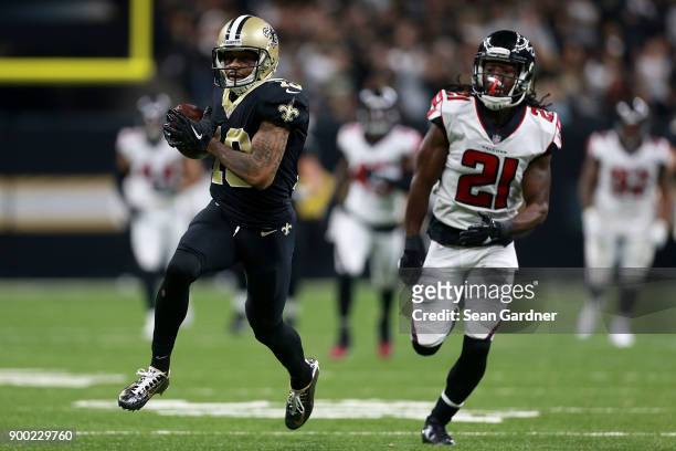 Ted Ginn of the New Orleans Saints scores a touchdown against Desmond Trufant of the Atlanta Falcons during the first half of a game at the...