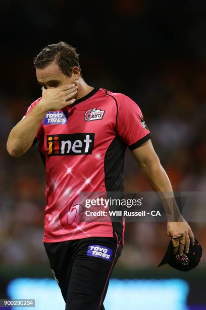 Stephen O'Keefe of the Sixers leaves the field after an injury during the Big Bash League match between the Perth Scorchers and the Sydney Sixers at...