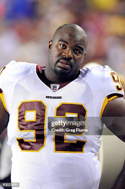 Albert Haynesworth of the Washington Redskins watches the game against the Pittsburgh Steelers at Fed Ex Field on August 22, 2009 in Landover,...