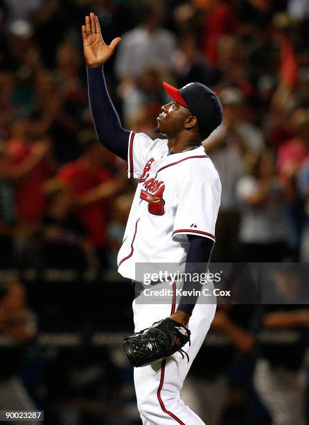Closing pitcher Rafael Soriano of the Atlanta Braves celebrates after defeating the Florida Marlins 4-3 on August 22, 2009 at Turner Field in...