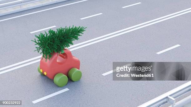 toy car carrying christmas tree on the roof - spielzeugauto stock-grafiken, -clipart, -cartoons und -symbole