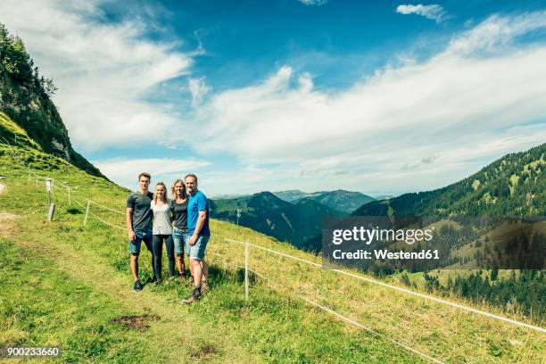 germany, bavaria, pfronten, portrait of happy family on alpine meadow near aggenstein - portrait of a woman 40 50 summer stock pictures, royalty-free photos & images