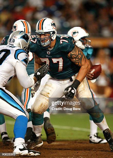 Offensive lineman Jake Long of the Miami Dolphins drops back to block against the Carolina Panthers during a pre-season game at Land Shark Stadium on...