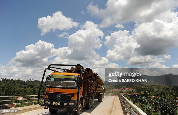 Malaysia-environment-rights-Penan BY SARAH STEWART In a picture taken on August 19 a truck transports timber collected from logging deep in the...