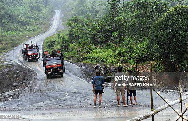 Malaysia-environment-rights-Penan BY SARAH STEWART In a picture taken on August 20 Penan tribespeople with spears block the road as plantation...
