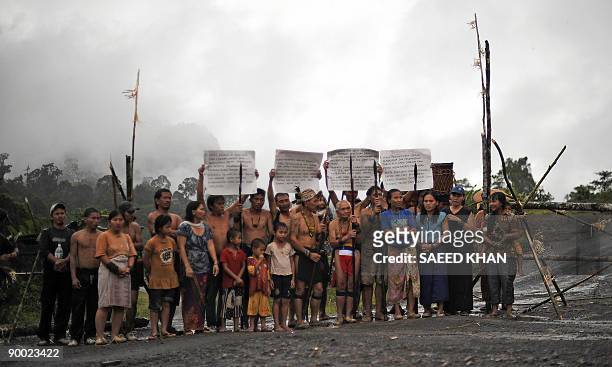 Malaysia-environment-rights-Penan BY SARAH STEWART In a picture taken on August 20 Penan tribespeople man a blockade with banners and spears to...