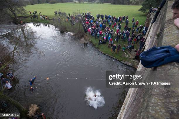 Man takes part in the Mappleton Bridge Jump, an annual unofficial tradition where those willing jump from Okeover bridge on New Years Day into the...