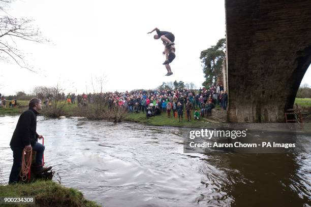 Two men take part in the Mappleton Bridge Jump, an annual unofficial tradition where those willing jump from Okeover bridge on New Years Day into the...