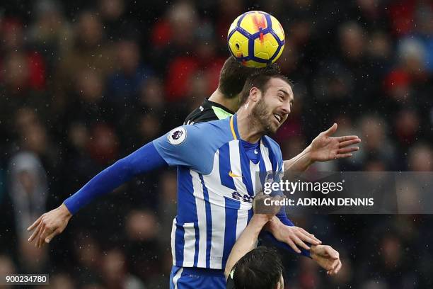 Brighton's English striker Glenn Murray vies with Bournemouth's English defender Simon Francis during the English Premier League football match...