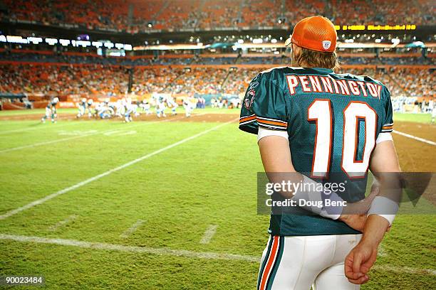 Quarterback Chad Pennington of the Miami Dolphins watches from the sidelines as his team takes on the Carolina Panthers during a pre-season game at...